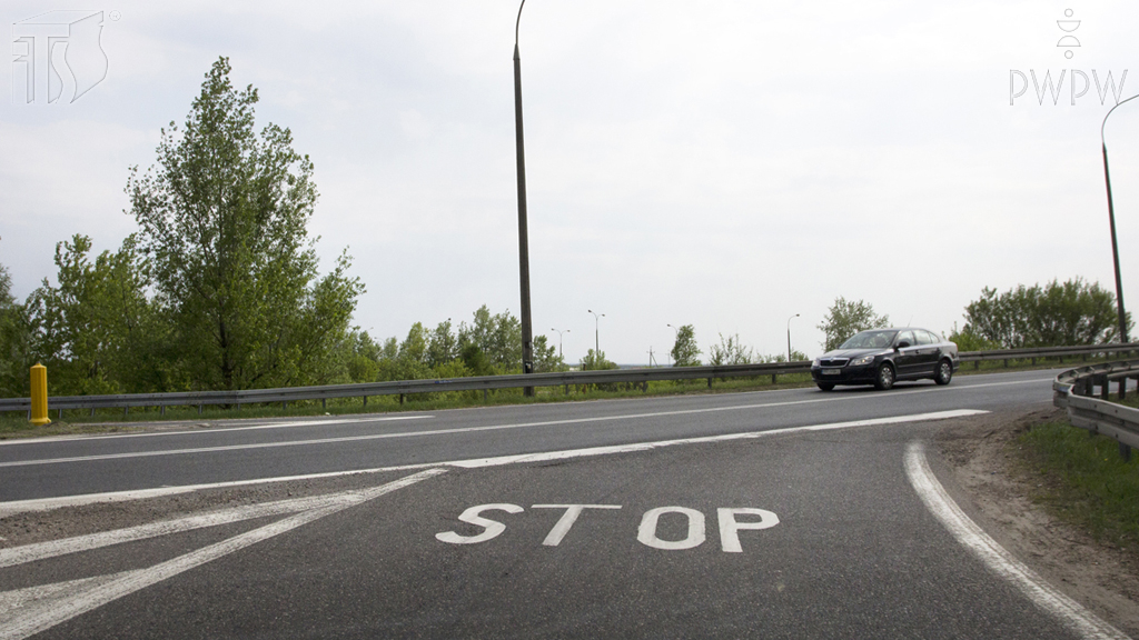 Material for the question: Does the word "STOP" on the roadway confirm the marking of the entry to the junction with a vertical "stop" sign?