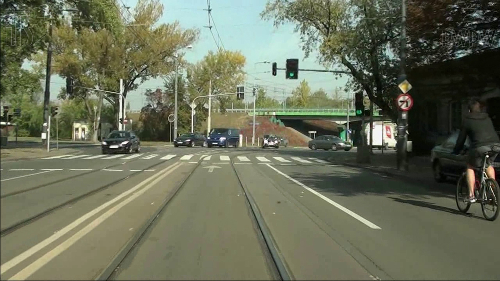 Material for the question: In this situation, driving a tram, are you allowed to overtake the cyclist just before the pedestrian crossing sign?